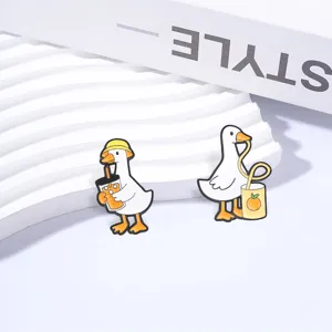 Set of funny cartoon white goose enamel pins drinking juice for backpacks and clothing