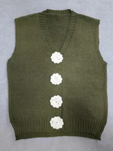 Women's autumn olive green V-neck knitted vest cardigan with cute white crochet flower buttons.