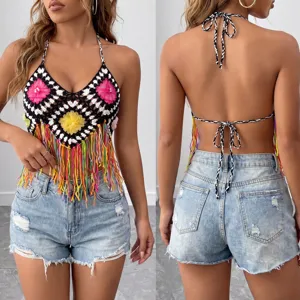 Handmade crochet halter top with colorful fringe and floral motifs for beach vacation.