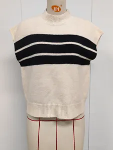Detailed texture of cream mock neck sweater vest with bold black horizontal stripes