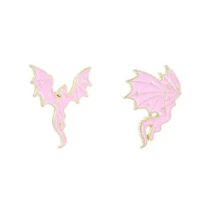 Dreamy pink and gold dragon enamel pins with sparkly star patterns for backpack decor