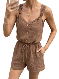 Tuta corta estiva casual a tinta unita con bretelle annodate e texture per donna chic.