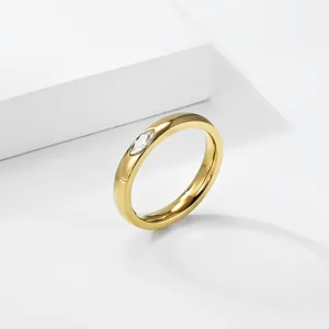 Close-up of 18K gold plated titanium ring featuring a marquise-cut zircon gemstone