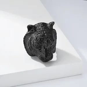 Detailed close-up view of a black titanium steel tiger head ring, cool punk style men jewelry.