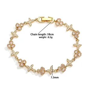 Detail view of gold clover butterfly bracelet showing 18cm length and 8.3g weight