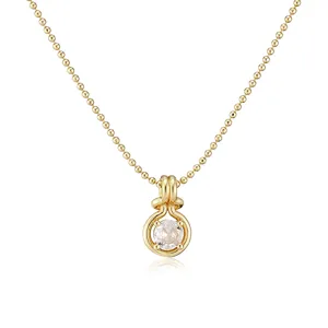 Detailed view of a gold-plated copper necklace featuring a round zircon pendant.