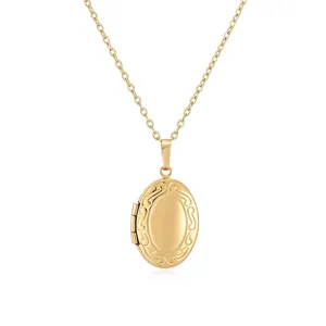 Detail view of a vintage gold oval locket necklace with delicate engravings