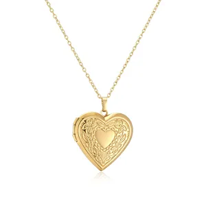 Macro detail of a vintage engraved heart-shaped gold photo locket necklace pendant.