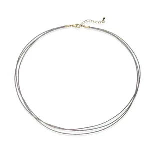 Detail of a colorful handmade woven three-layer choker with golden adjustable chain
