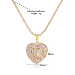 Detail view of heart pendant necklace with pink rhinestones showing size and weight.