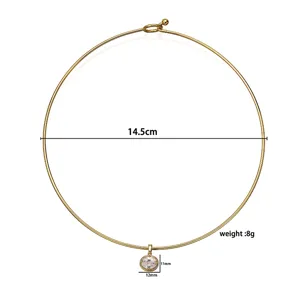 Detail view of gold choker necklace showing 14.5cm diameter and 12mm oval pendant