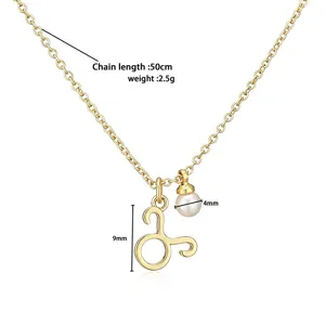 Detailed view of gold Taurus pendant necklace with 4mm pearl and 50cm chain length
