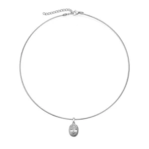 Detail view of silver oval zircon pendant on minimalist stainless steel choker necklace
