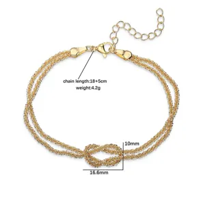 Dettaglio del bracciale placcato oro con nodo infinito e specifiche di lunghezza