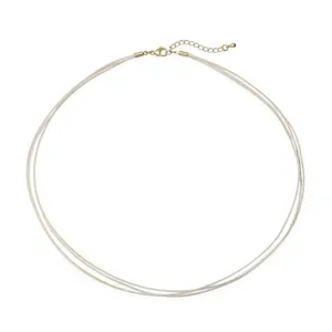 Detailed view of handmade three-layer braided choker necklace cord with gold lobster clasp