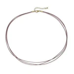 Detailed view of a triple-strand hand-braided cord necklace with adjustable gold clasp