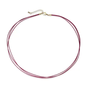 Detailed view of triple-strand burgundy woven cord necklace with gold-plated clasp