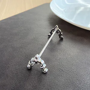 Close-up detail of ornate silver stainless steel chopstick and knife rest
