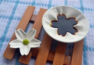 Cherry blossom ceramic sauce dish detail, cute Japanese style condiment tableware for home kitchen.