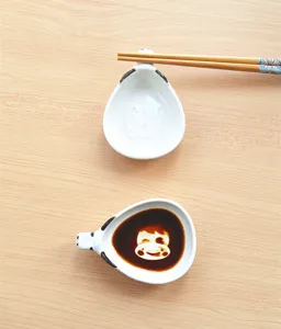 Japanese cute cartoon ceramic soy sauce dish detail view with cute animal design