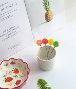 Stainless steel fruit forks set with cute citrus fruit shaped handles for kitchen and party use.