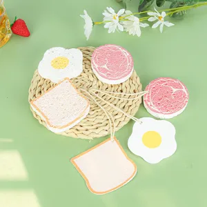 Éponge en cellulose de bois en forme d'aliments mignons pour le nettoyage de cuisine.
