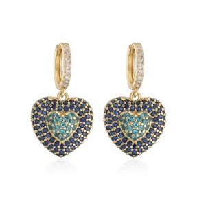 Detail view of heart hoop earrings with blue and turquoise pavé-set stones.