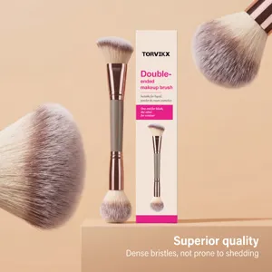 Close-up detail of double-ended makeup brush showing dense bristles and packaging