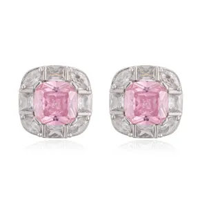 Close-up of square stud earrings with pink cushion-cut center stone and crystal halo