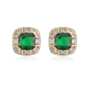 Macro view of 18K gold plated square stud earrings with emerald green gemstones