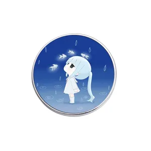 Artistic round metal enamel pin badge featuring a blue ponytail anime girl and fish