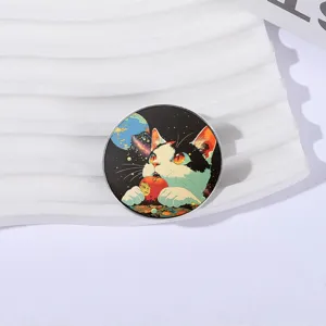 Round metal cat brooch pin with colorful illustration of cat and space theme