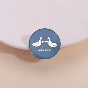 Cute round metal brooch badge featuring a funny goose bumps cartoon illustration