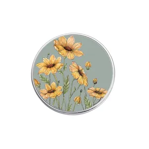 Vintage circular metal brooch featuring hand-drawn yellow sunflowers on a green background