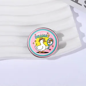 Funny round enamel pin badge featuring a white duck and 'Am I the Drama?' quote design