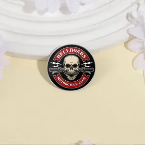 Vintage round metal badge featuring a skull and motorcycle club motif on a display stand