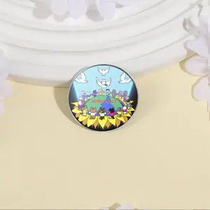 Cartoon animal peace brooch featuring cats, doves, and World Peace text on metal badge.
