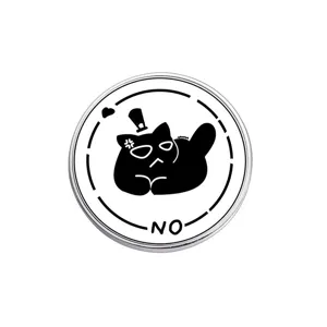 Detail view of a round white metal pin badge with a black grumpy cat and NO slogan