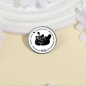 Round metal brooch badge featuring a mysterious black cat design with NO text detail