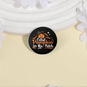 Cute round Halloween metal brooch featuring the Cutest Pumpkin in the Patch text