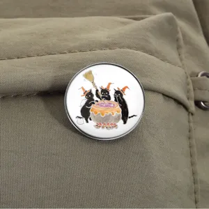 Round Halloween black cat metal badge brooch pinned to a durable canvas backpack strap