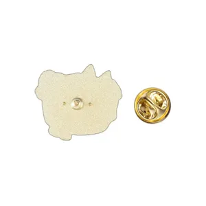 Macro detail view showing the golden metal back and clutch of a cat enamel pin