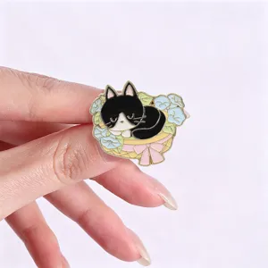 Close-up of a cute black and white cat sleeping in a flower basket enamel pin badge
