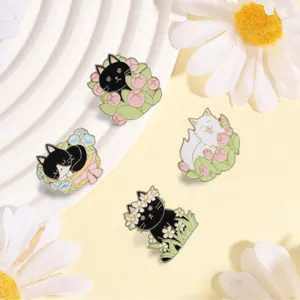 Detailed view of four cute cartoon cat enamel pins with floral spring themes.