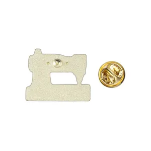 Back view of a vintage sewing machine enamel pin with a gold-colored butterfly clutch.