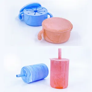 Detail view of marble-patterned silicone baby snack bowls and straw cups