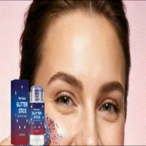 Close-up of holographic glitter stick makeup applied to cheek with product packaging
