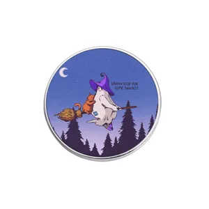 Round Halloween ghost metal badge featuring a cute ghost and cat on a broomstick