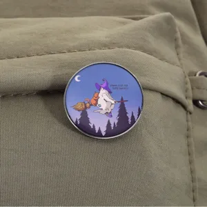 Round Halloween ghost metal brooch pin featuring a cute ghost and cat on a broomstick