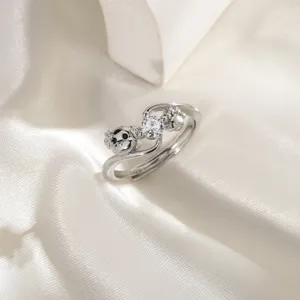 Macro detail view of a silver puppy ring with sparkling zircon and dog paw print design